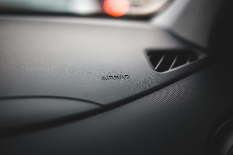 Close-up view of the airbag sign on a modern car dashboard indicating safety features.